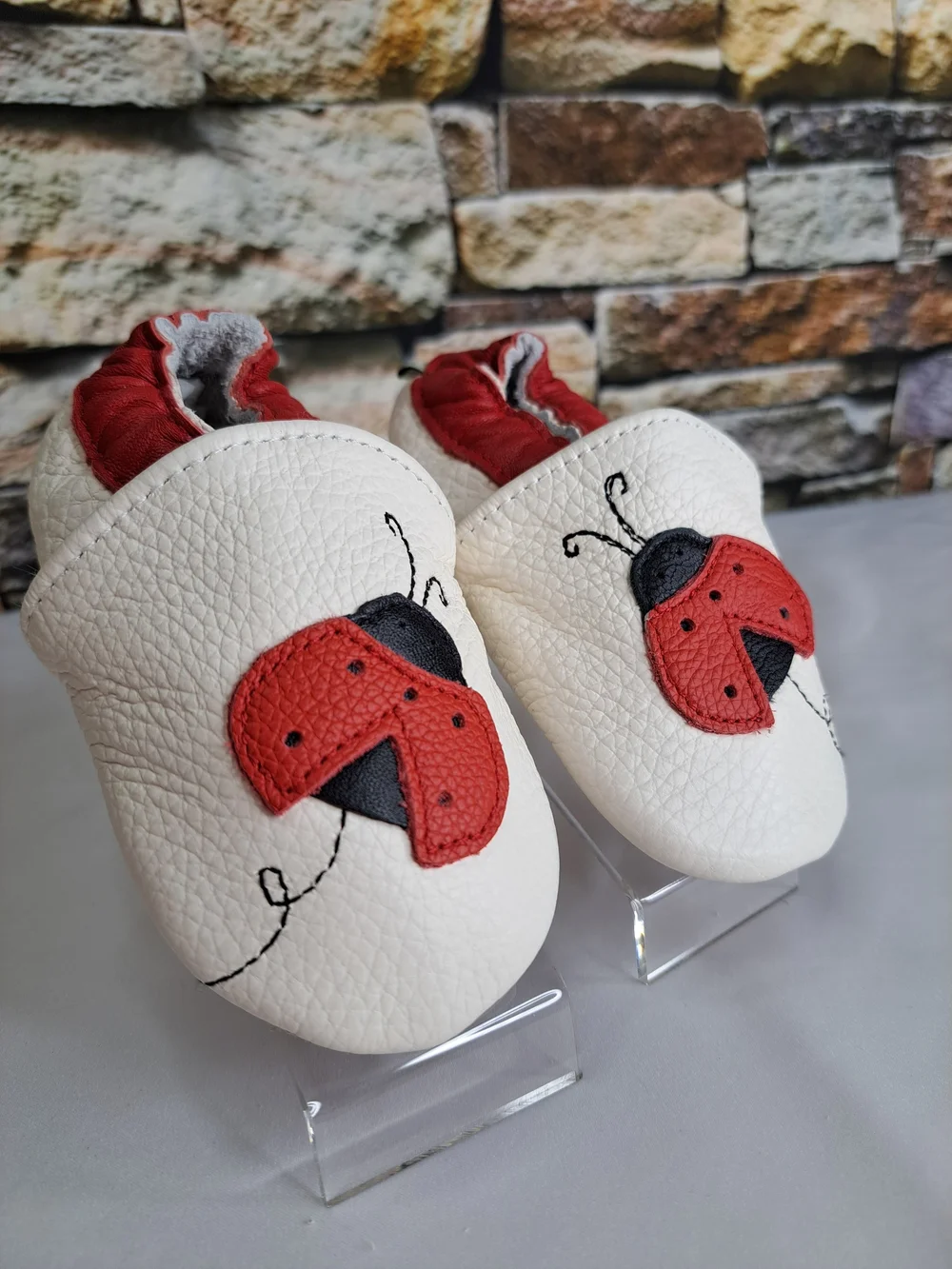 Baby White Leather Slip-On Shoes with Red Ladybug Detail